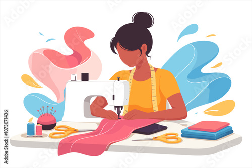 Young african female tailor sewing fabric with machine in creative workspace