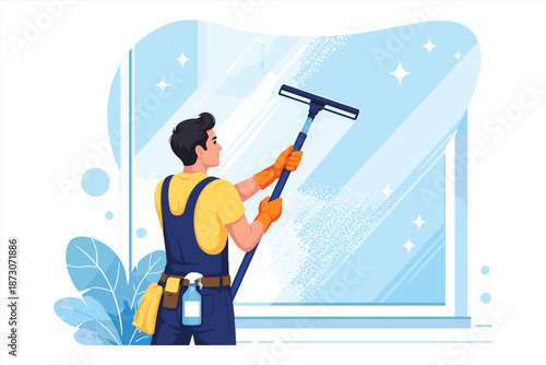 Young caucasian male window cleaner in overalls with squeegee