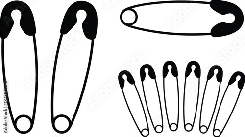Black and white of safety pins in various orientations metal