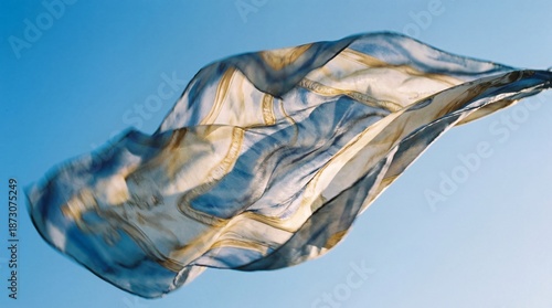 A silk scarf dances and flo...