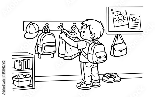 Young boy with backpack hanging up his jacket in a school cloakroom