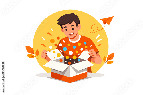 Young male child enjoying surprise gift unboxing with paper airplane