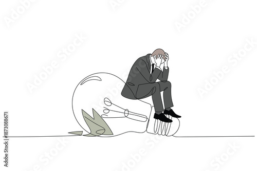 A man sits on a broken lightbulb, contemplating his situation.