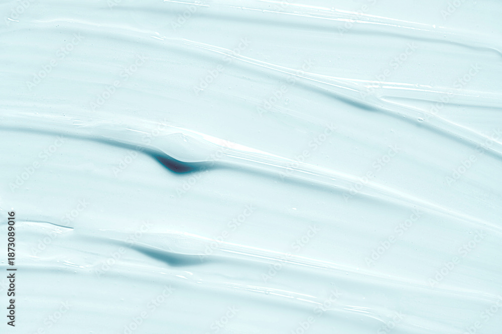 Obraz premium Marine blue opaque or peel-off mask milk lotion sample background. Beauty product sample swatch