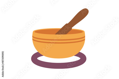 Wooden bowl with stick placed on a circular mat in a simple design setting