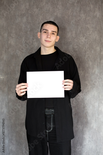 Young Man Holding Blank White Sign for Your Message