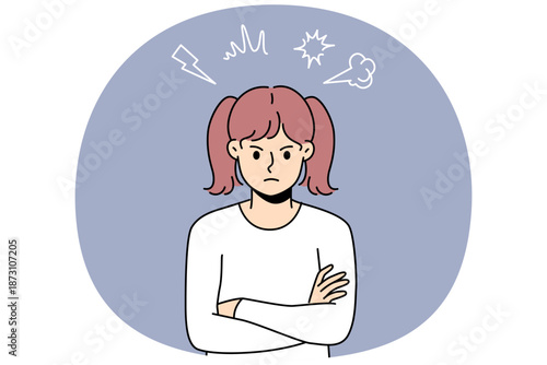 Angry little girl stands with arms crossed and looks at screen with hatred, showing disobedience or resentment. Teenage child needs parental affection to get rid of hatred and negative emotions