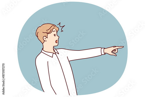 Surprised man with WOW emotions points finger to side, draw customer attention to copy space. Surprised guy attract interest of potential customers to advertised goods and services.