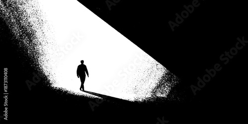 Silhouette of person walking in stark black and white abstract light and shadow