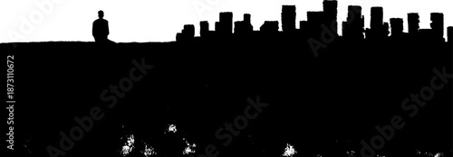 Silhouette of lone female overlooking urban cityscape at dusk