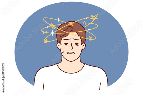 Man with dizziness and stars flying around head looks at camera in confusion after blow or fall. Confused young guy with dizziness suffers from high blood pressure and health problems