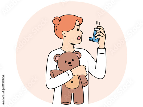 Little girl with asthma uses inhaler to restore breathing during attack and holds teddy bear in hands. Child is experiencing problems due to asthma or allergic reaction and needs to be seen by doctor