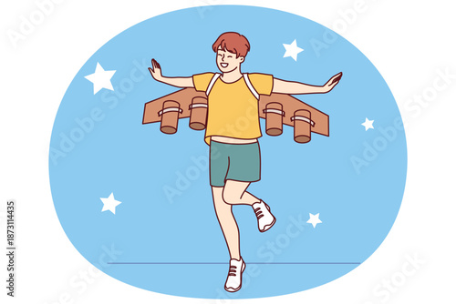 Little boy dreams of becoming pilot or astronaut and jumps in suit with airplane wings. Cheerful teenager imagines that became professional pilot and went to fly through starry sky