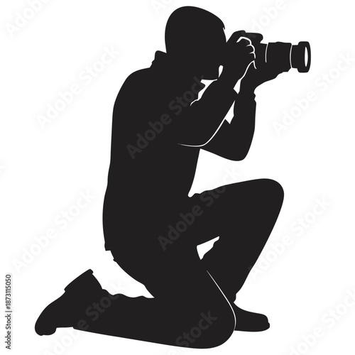 A solitary photographer kneels capturing a moment with focused dedication and skill