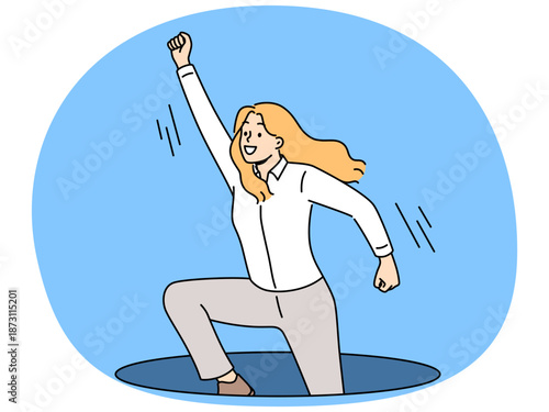 Ambitious business woman jumps out of hole in ground with hand raised up, wanting to achieve success. Ambitious businesswoman in pose superhero ready to help colleagues in solving corporate problems