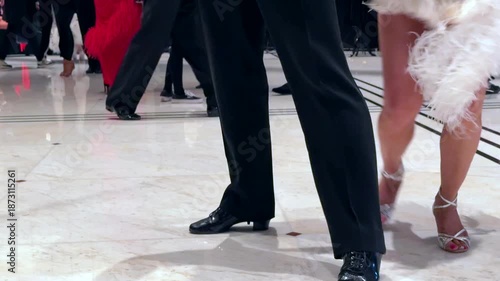 Synchronized movement of two dancers feet representing coordination, rhythm and effective cooperation. Concept of working together in harmony.