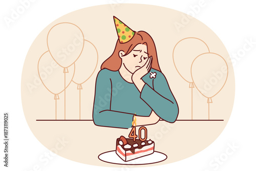 Lonely woman at birthday party with cake and balloons is sad due to approach of old age or lack of friends. Distressed girl in birthday hat sits at festive table and needs psychological support