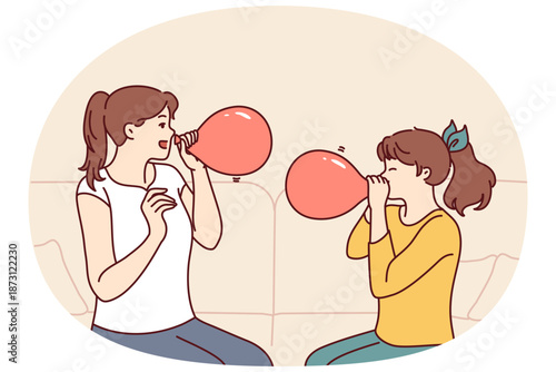 Mother and daughter inflate balloons sitting on sofa to decorate apartment for birthday party. Girl together with older sister, uses balloons to play or inhale helium to change voice