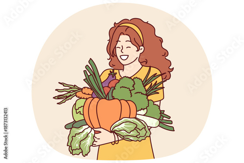 Woman with vegetables in hands rejoices good harvest or favorable prices for food at farmers market. Vegetarian girl holding organic vegetables for making healthy soups and tasty salts.
