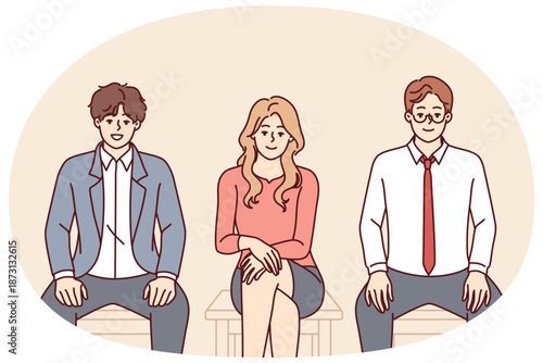 Business people sit on chairs in line for interview for manager position in corporation. Men and woman want to get job with high salary and insurance are waiting for call from business executive.