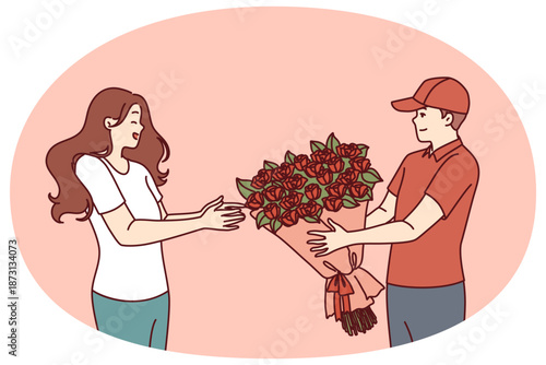 Flower delivery man hands bouquet to woman delighted with unexpected valentine day gift from boyfriend. Courier hands bouquet of red roses to happy client, to advertise services of flower shop