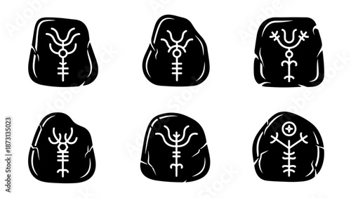 Set of six black runic stones with white symbols.