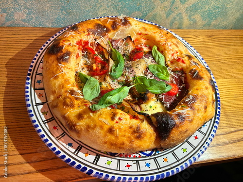 Authentic Neapolitan pizza. Fermented, fluffy sourdough dough. A close-up of a mouth-watering pizza. A truly Italian pizza.