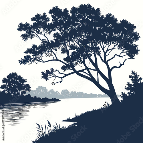 Silhouette of a tree by a river