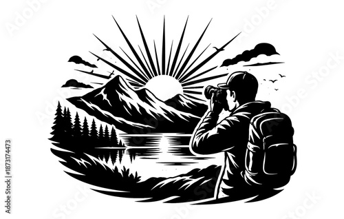 Silhouette of photographer capturing mountain sunrise by lake