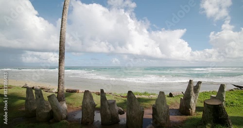 Ocean view from shore with wooden chairs for meeting.  Wide angle. Jib camera movement. 