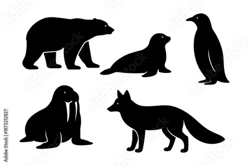 Silhouette compilation of arctic animals including penguin, seal, walrus, and fox.