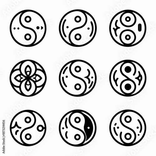 Set of nine black and white yin yang symbols with various patterns on a plain white background.