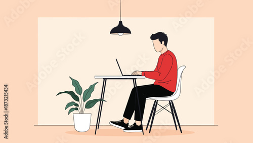 Young professional working remotely on laptop in modern home office