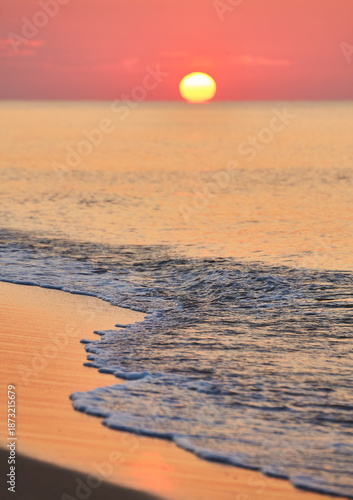 Sunrise Over Calm Ocean Waters