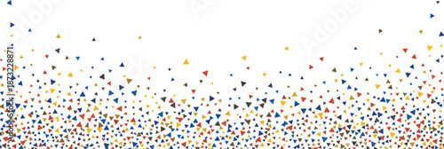 Multicolored confetti particles falling against a white background in a festive atmosphere