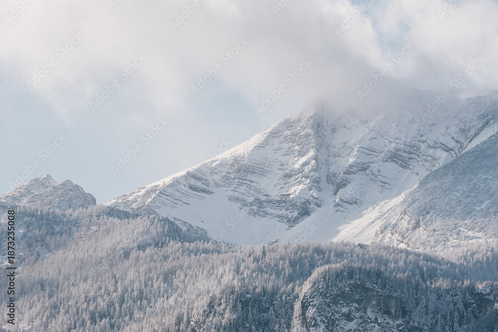 Obraz premium Warscheneck mountain in snowy and windy landscape in the pyhrn priel region