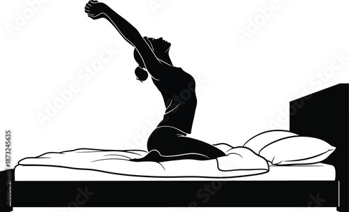 Silhouette of a woman waking up in bed stretching her arms high above her head feeling refreshed and ready for the new day after a long night's rest