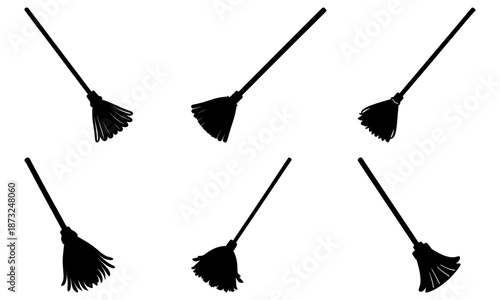 Five Black Brooms with Long Handles on White Background cleaning housekeeping