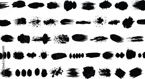 Set of various black paint brush strokes and ink splatters on a transparent background