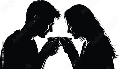 A romantic couple sharing a toast with wine glasses in a silhouette