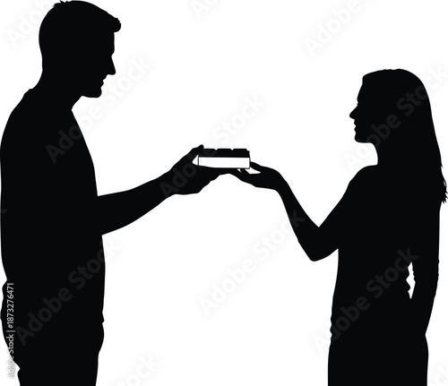 A silhouette of a man and woman exchanging a small object