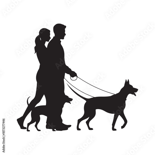 A silhouetted couple enjoys a leisurely walk with their two canine companions in a peaceful park setting
