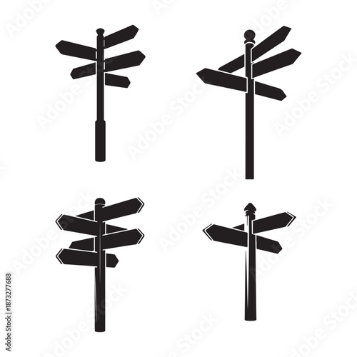 A collection of isolated directional signs on white posts showcasing various arrow indications for guidance