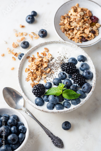 Healthy breakfast bowl with muesli, greek yogurt and berries