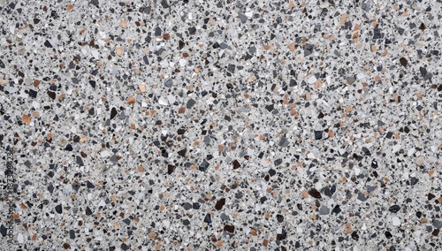 Close View of Gray Stone Surface With Small Rocks and Pieces in Various Colors