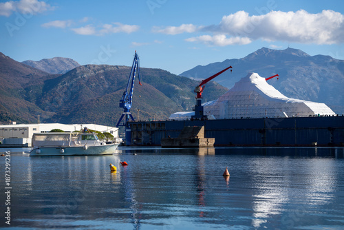 Luxury yacht refit, repair, service and maintenance in a floating dock at a marina.