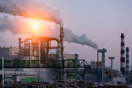 Air pollution in the city. Smoke from the chimney on blue sky background