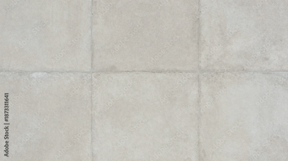 Fototapeta premium A close-up view of a tiled floor with a subtle texture and light gray grout lines