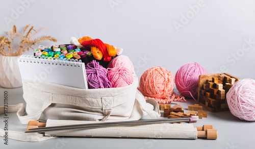 A tote bag with craft and leisure items on a table web banner