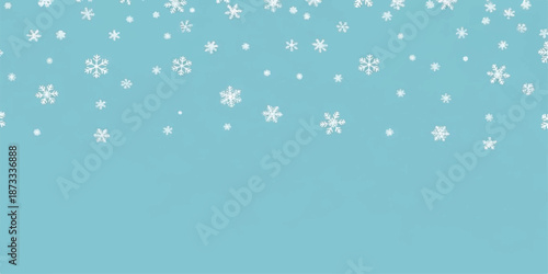 Snowflakes falling on light blue background